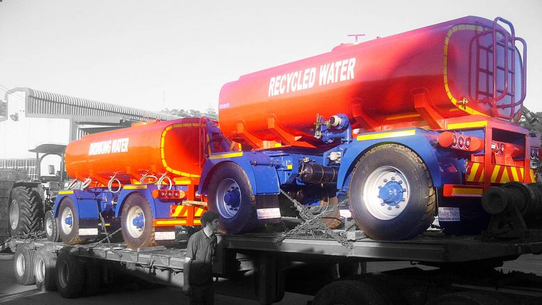 drawbar water tankers on a lowbed for delivery